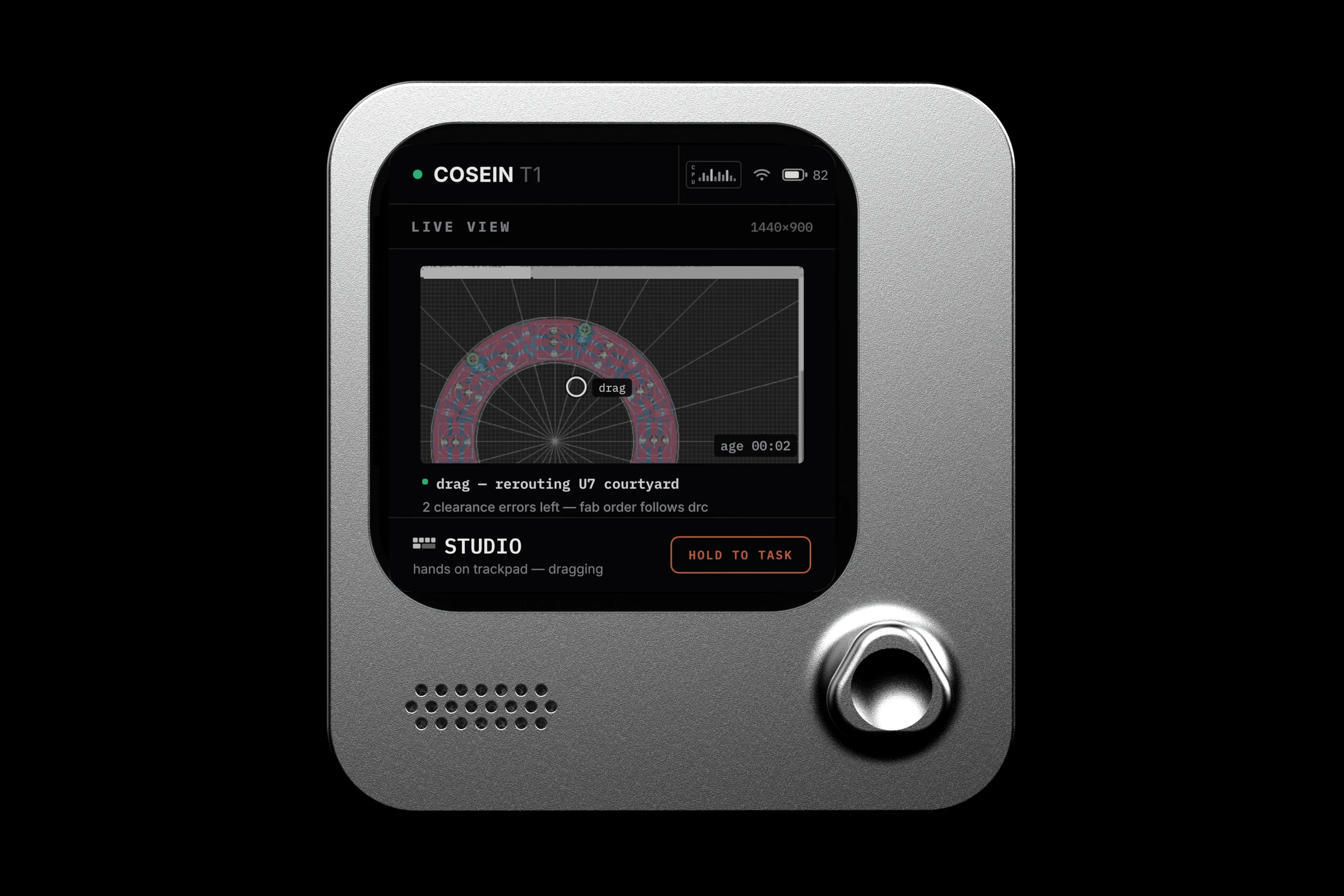 the cosein T1 from the front, its screen showing the live view of the computer it drives: a ring-shaped circuit board being rerouted