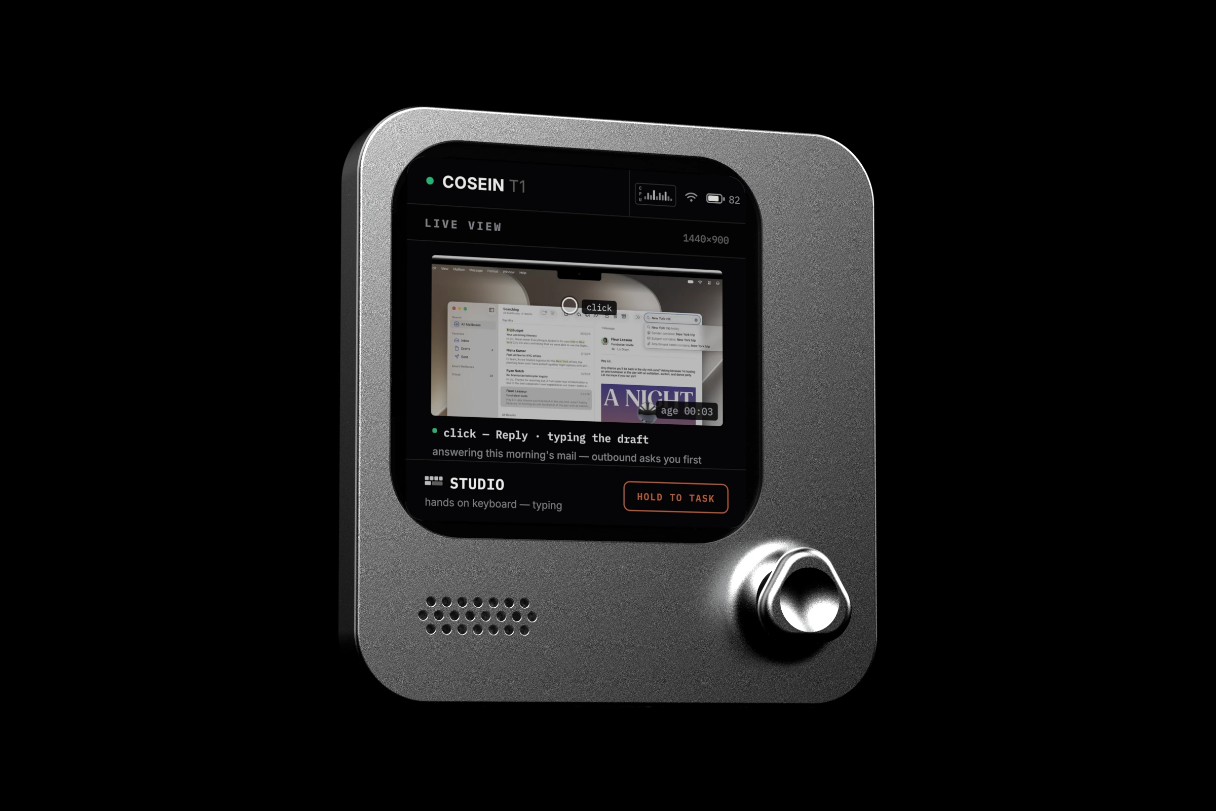 the cosein T1 at an angle, its screen showing a live view of the computer it works on: replying to mail